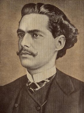 Retrato histórico de Olavo Bilac, o renomado poeta e membro da Academia Brasileira de Letras. O escritor aparece jovem, com bigode e cabelos escuros ondulados, vestindo um terno formal em uma pose contemplativa.